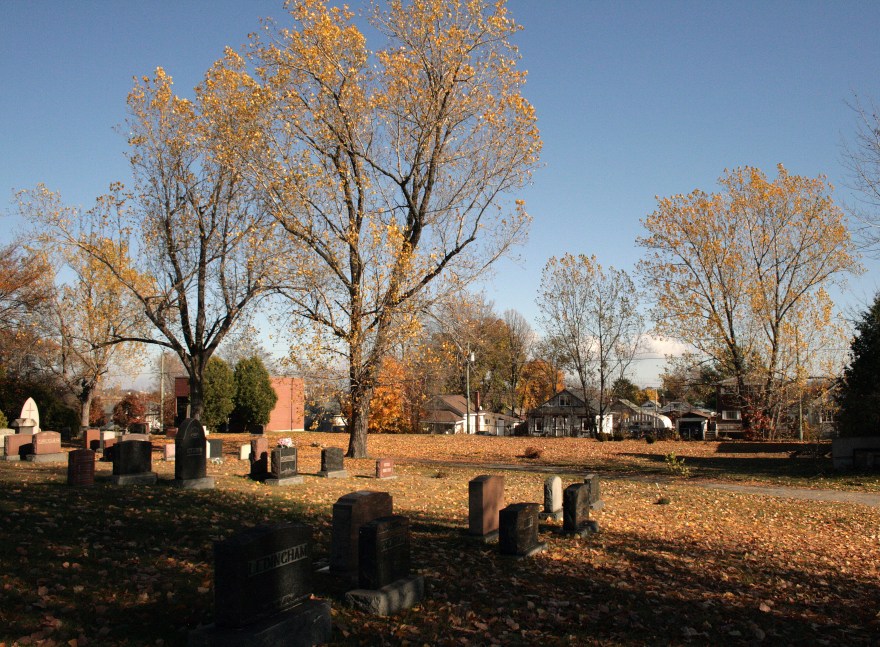 Sunny autumn day in a cemetery.