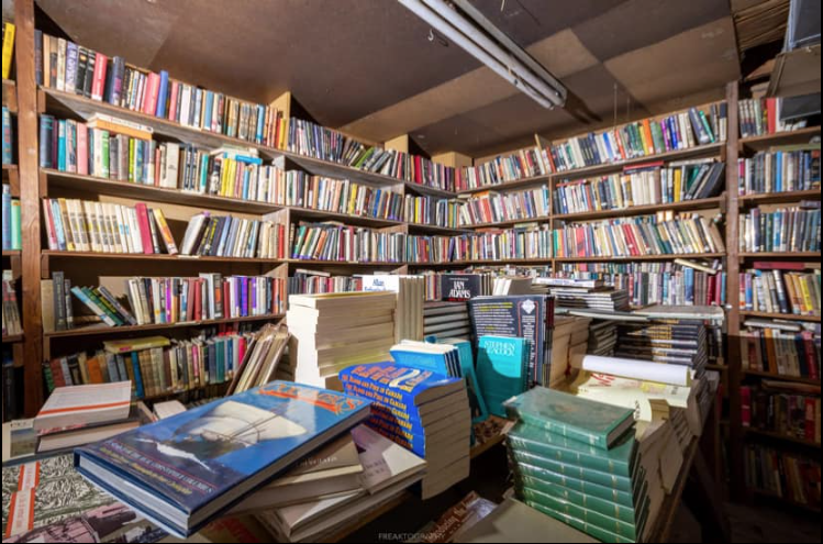 Dusty bookshelves full of books