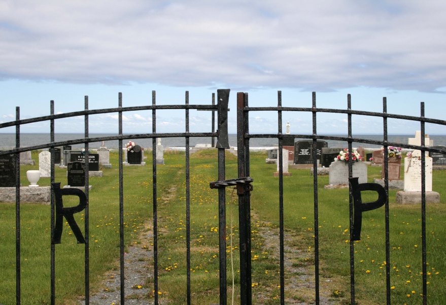 Cemetery gate with the letters "R.I.P."